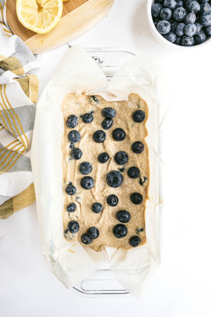 Overhead photo of lemon blueberry batter in a loaf pan 