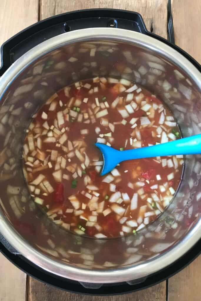 Overhead shot of chicken tortilla soup in an instant pot before cooktime.