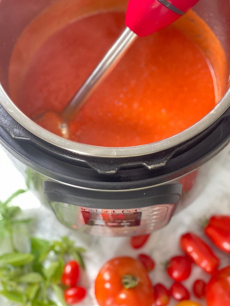 Blended tomato sauce in the Instant Pot using an immersion blender.