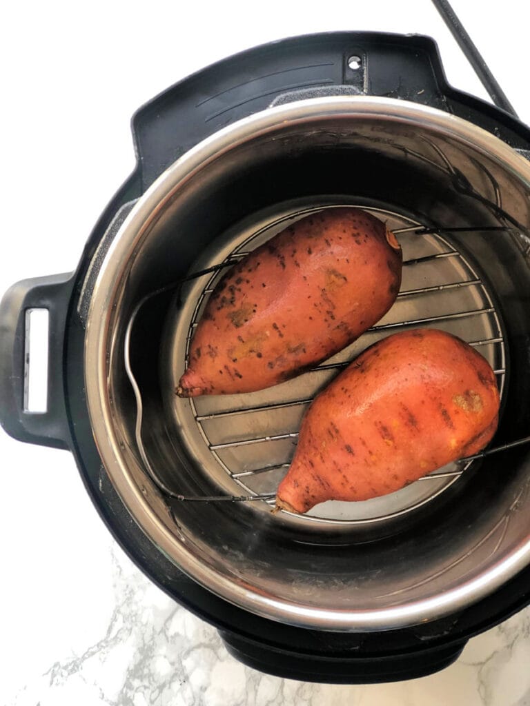 A photo of two sweet potatoes in the Instant Pot