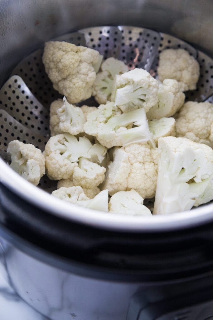 A photo showing how to steam cauliflower for cauliflower mash in the instant pot