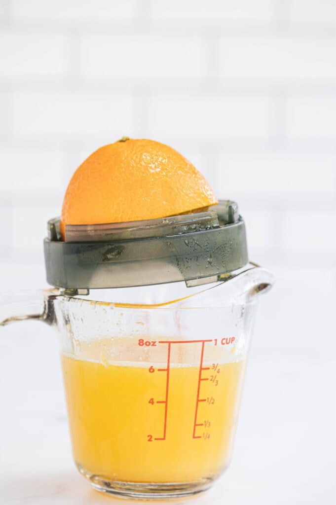 Freshly squeezed orange juice in a measuring cup 