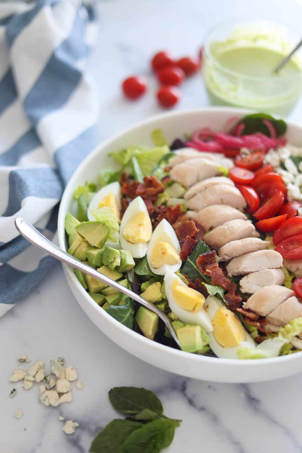 Bowl of Copycat Panera Cobb Salad with toppings arranged on top