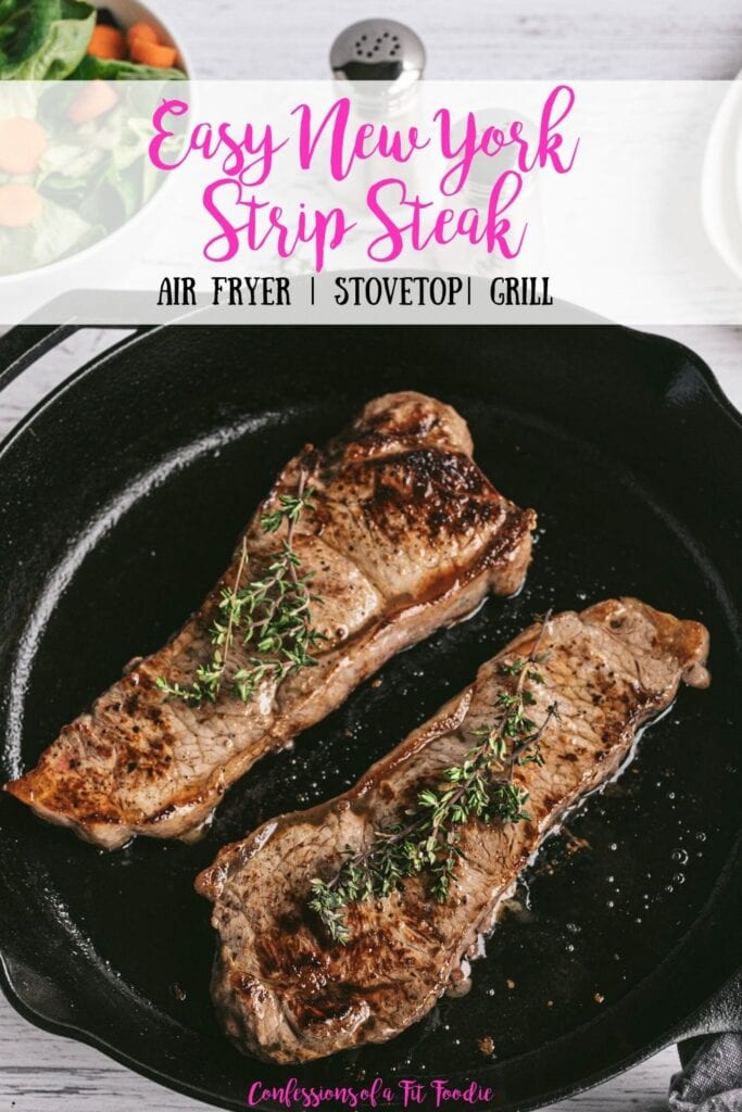 Overhead photo of Two New York Strip Steaks grilled in a Cast Iron Skillet with salt and pepper shakers and a salad in the background. With the text overlay- Easy New York Strip Steak | Air Fryer | Stovetop | Grill | Confessions of a Fit Foodie